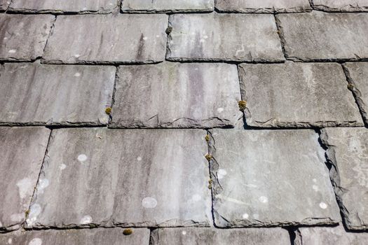 A slate tiled roof. on a traditional house