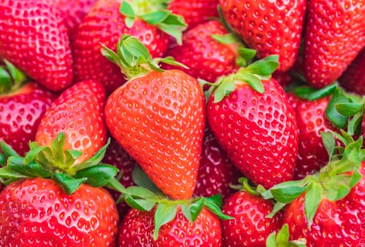 Fresh red strawberries background, close-up