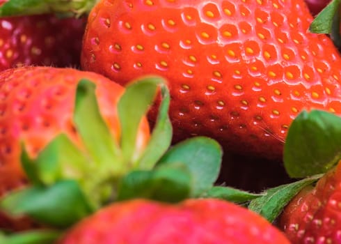 Red strawberries fruit background, close-up
