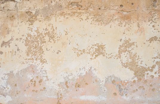 Vintage wall with peeling paint plaster