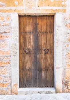Close-up of brown wooden door of mediterranean house