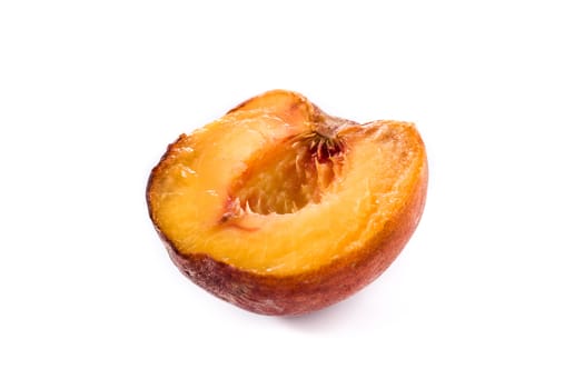 Piece of peach fruit isolated on white background