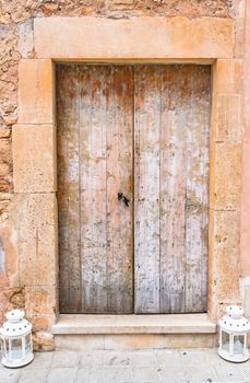Close-up of rustic old wooden front door