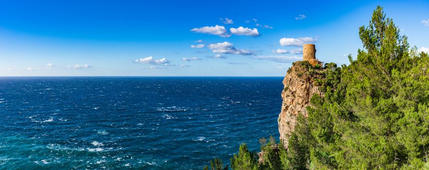 Old medieval watch tower Torre del Verger at the northwest coast of Majorca island, Spain Mediterranean Sea