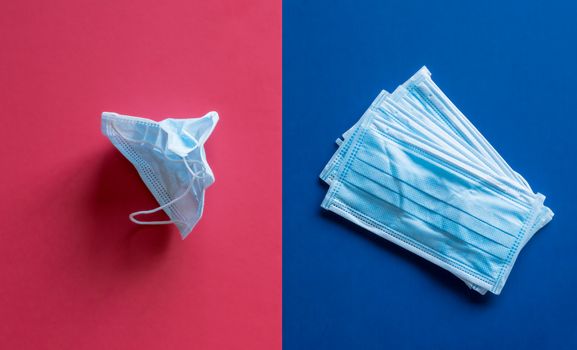 Concept of split between red states and blue states in USA over wearing of face masks as protection against coronavirus