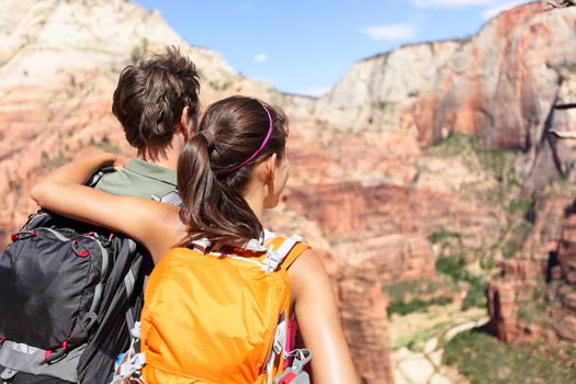 Hiking - hikers looking at view in Zion National park. People living healthy active lifestyle dong hike in beautiful nature landscape to Observation Point near Angles Landing, Zion Canyon, Utah, USA.