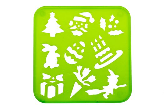 Holiday stencil shapes on a green background