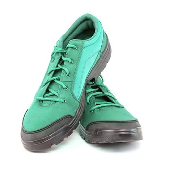 a pair of cheap aqua mint turquoise green hiking shoes isolated on white background - perspective close-up view.