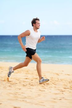 Sports fitness runner man running on beach. Handsome young fit sporty male athlete jogging outside on beautiful beach training in running shoes. Caucasian male model in his 20s working out.
