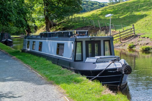 Canal boat moored on the banks of the Llangollen canal North Wales