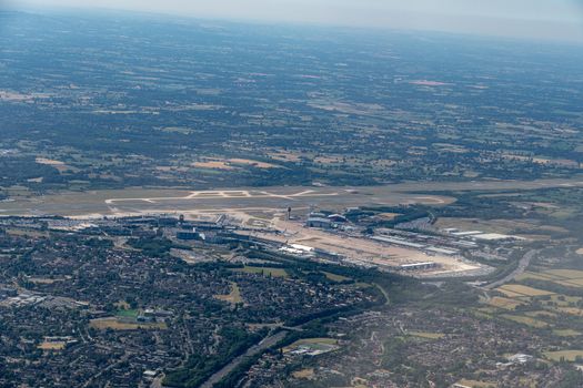 Aerial shot from a plane window of an airport in Manchester