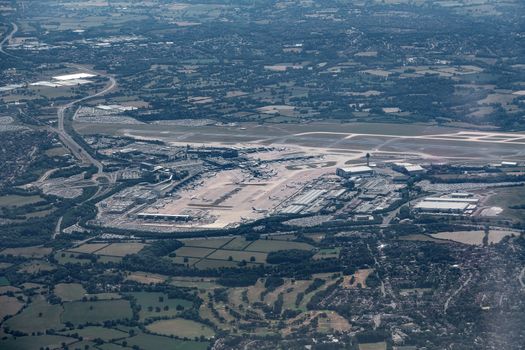 Aerial shot from a plane window of an airport in Manchester