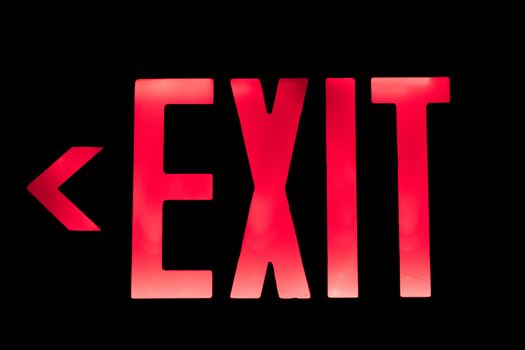 Lit Red Exit Sign pointing to the Left