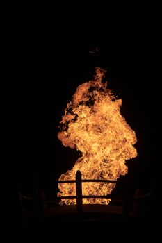 View of fire coming from a large outdoor lantern