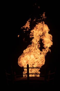 View of fire coming from a large outdoor lantern