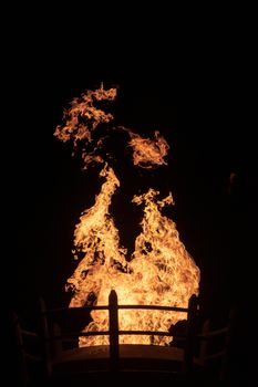 View of fire coming from a large outdoor lantern