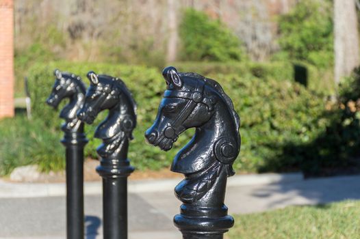 Black painted bollard   shaped as a horse head