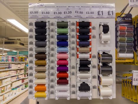 CHESTER, UK - FEBRUARY 28TH 2018: Sewing thread in various colours on display in a shop