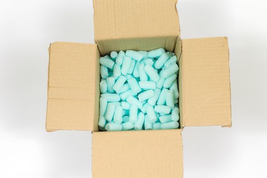 Box filled with blue styrofoam pellets