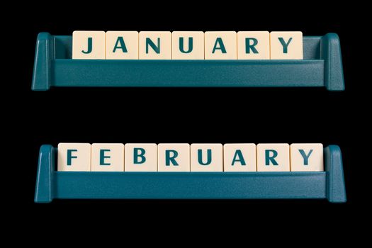 Month title made from game piece tiles. Words include January and February