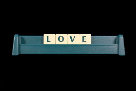 Word love made from game piece letters