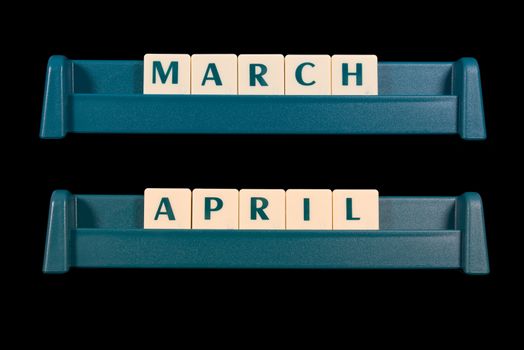 Month title made from game piece tiles. Words include March and April