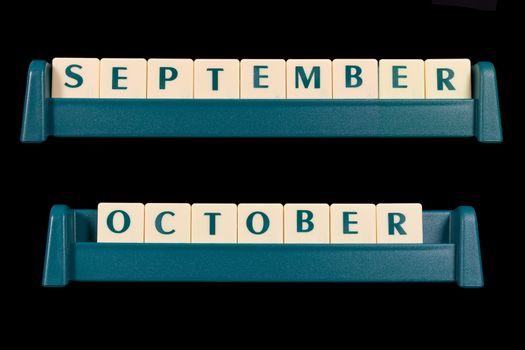 Month title made from game piece tiles. Words include September and October