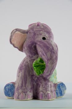 Homemade ceramic elephant on a white background