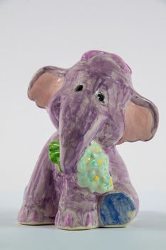 Homemade ceramic elephant on a white background