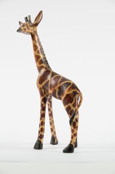 Giraffe model figurine on a white background