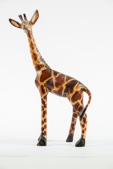 Giraffe model figurine on a white background