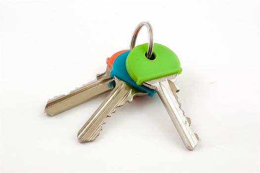 Three House Keys with coloured caps