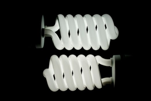 Two low energy spiral light bulbs illuminated