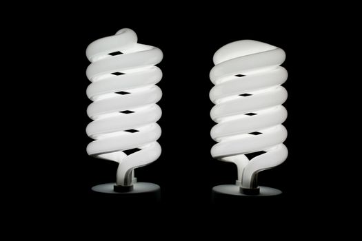 Two low energy spiral light bulbs illuminated