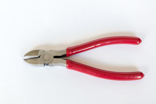 Red handle wire cutters on a white background