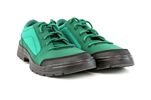 a pair of cheap aqua mint turquoise green hiking shoes isolated on white background - perspective close-up view.