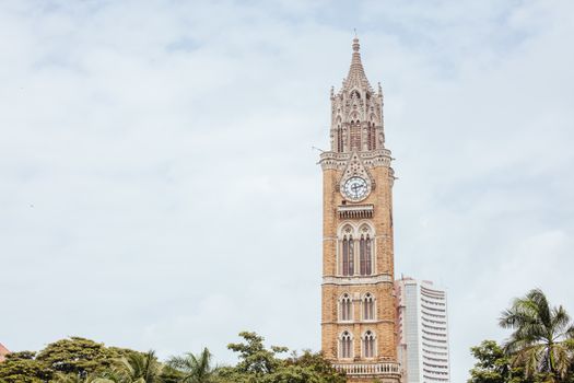 Rajabai Clock Tower and Oval Maidan on a clear evening in Mumbai India