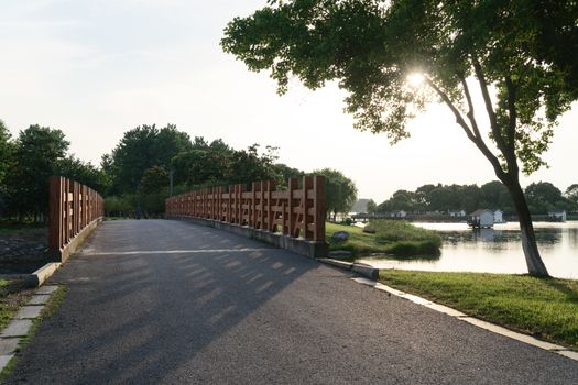 The pathway bridge in the public park. Photo in Suzhou, China.