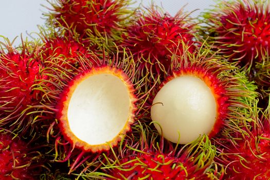 Exotic ripe rambutan fruits from Southeast Asia. Typically found in Indonesia, Malaysia, Thailand and the Philippines.