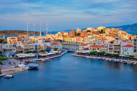 Beautiful Agios Nikolaos town on lake Voulismeni on sunset. Lasithi region of Crete island, Greece