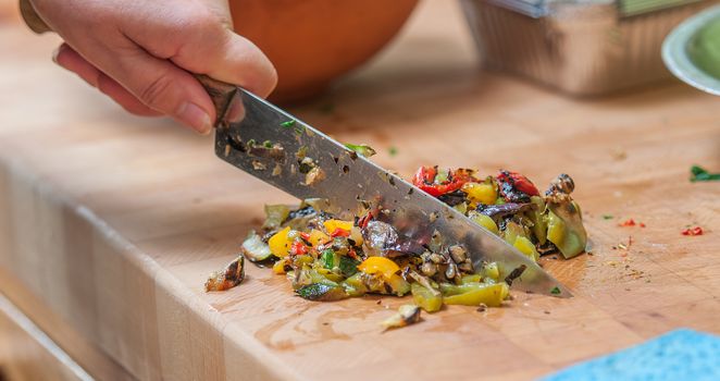 mediterranean vegetables being chopped up