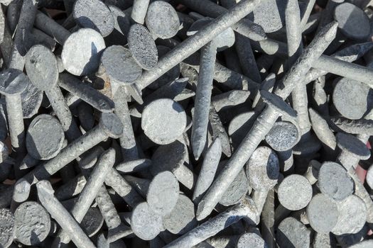 A heap of old metal galvanised steel nails background