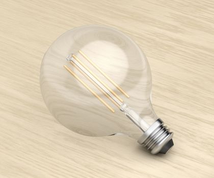 Decorative LED bulb on wooden background