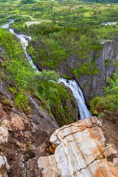 Falls in mountains of Norway. Waterfall Voringfossen - the fourth highest peak in Norway. Voringsfossen Waterfall. Beautiful view of the Voringsfossen waterfall. Bjoreio river. Norway.