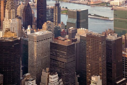 New York City Manhattan street aerial view with skyscrapers. Skyscrapers New York. Skyscrapers aerial. Skyscrapers in New York at sunset.