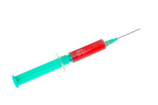A green syringe with red liquid isolated against white background