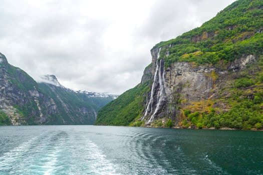 Fjord in Norway, nature and travel background. Fjords are long narrow sea bays crashing deep into the land. Tourism holidays and travel.