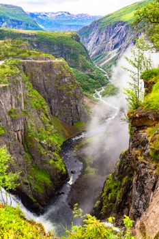 Beautiful view of the Voringsfossen waterfall. Bjoreio river. Norway. Falls in mountains of Norway. Waterfall Voringfossen - the fourth highest peak in Norway. Voringsfossen Waterfall.