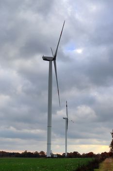 Panoramic view on alternative energy wind mills in a windpark