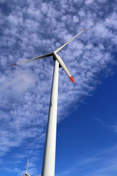 Panoramic view on alternative energy wind mills in a windpark